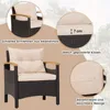 A close-up and detail shots of a rattan armchair with cushions, highlighting its features. Voir les images du produit