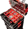 A close-up, angled view of an open tool box with various compartments filled with hardware and tools. Náhled obrázku produktu