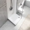 A modern bathroom with a shower tray and a toilet. Produktbild-Vorschau
