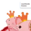 Close-up of two illuminated orange crowns on a pink toy carriage. Produktbild-Vorschau
