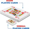 A comparison of giant playing cards and normal playing cards, with text labels indicating each. Anteprima dell’immagine prodotto