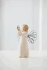 A small angel figurine holding a butterfly. Produktbild-Vorschau