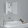A white bathroom cabinet with its door open, above a white sink. Produktbild-Vorschau