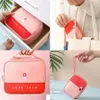 A collage of four images showing a pink and red medical organizer bag in different settings. Náhľad obrázku produktu