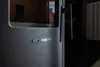 A close-up view of a gray pellet stove with the brand name 'SCHENGER' visible. Anteprima dell’immagine prodotto
