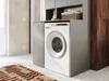 A laundry room with a washing machine and cabinets. Produktbild-Vorschau