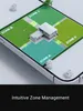 A 3D rendering of a smart lawn mower system displayed on a smartphone screen, showing different zones of a lawn and a house. Produktbild-Vorschau