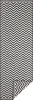 A black and white chevron patterned rug, with a corner folded back. Voir les images du produit