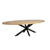 An oval wooden dining table with a black starburst base, isolated on a white background. Voir les images du produit