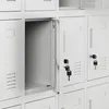 A close-up view of a white metal locker with one door open, revealing the interior. Several other lockers are visible in the background. Anteprima dell’immagine prodotto