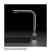 A modern kitchen faucet with a sleek design, shown in a studio setting against a dark background. Podgląd zdjęcia produktu