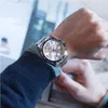 A person wearing a watch on their wrist. Produktbild-Vorschau