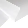 A close-up, angled view of a roll of translucent white window film, with one edge curled up. Voir les images du produit