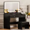 A black vanity table with a lighted mirror and a stool, set up in a room. Produktbild-Vorschau