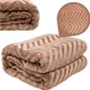 A folded brown blanket with a chevron pattern is shown against a white background. Podgląd zdjęcia produktu