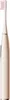 A close-up studio shot of a gold and white electric toothbrush. Voir les images du produit