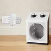 A white digital thermostat plug is plugged into a white power strip, which is connected to a white electric heater. Náhled obrázku produktu