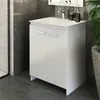 A white bathroom vanity with a sink and faucet, set against a dark tiled wall. Produktbild-Vorschau