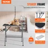 A golden retriever dog is lying on a grooming table in what appears to be a grooming salon or bathroom setting. The image highlights the features of the grooming table. Anteprima dell’immagine prodotto