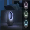 A split image showing a bladeless fan on the left and three smaller images of the same fan with different colored lights on the right, set in a dimly lit room. Produktbild-Vorschau