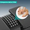 Close-up view of a black foot massager with a circular inset showing a person massaging a foot. Produktbild-Vorschau