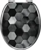 A toilet seat lid with a hexagonal pattern. Produktbild-Vorschau