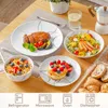 A table setting with various dishes and tableware, including a main course, salad, cereal, and dessert, along with a coffee maker and a glass of water. Náhled obrázku produktu
