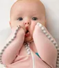 Close-up of a baby wearing a pink swaddle. Anteprima dell’immagine prodotto