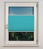 A turquoise pleated blind is installed in a white window frame, covering the middle section of the window. The top and bottom sections of the window reveal a blue sky and a green forest, respectively. Produktbild-Vorschau