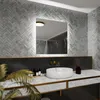 A modern bathroom vanity with a sink, faucet, and mirror. Produktbild-Vorschau