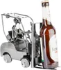 A metal figurine of a forklift with a person driving it, holding a beer bottle. Podgląd zdjęcia produktu