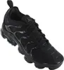 A black Nike Air Vapormax Plus shoe is shown from a slightly elevated side angle against a white background. Náhled obrázku produktu