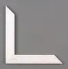 A white weathered picture frame corner against a gray background. Produktbild-Vorschau