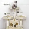 A cat sitting on a multi-level cat tree with various features highlighted by text labels. Voir les images du produit