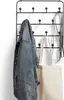 A black metal coat rack with wooden knobs mounted on a white wall, holding a denim jacket, a canvas tote bag, and a dog leash. Produktbild-Vorschau