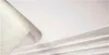 A close-up view of a rolled-up textured material, possibly fabric or paper, with a white surface underneath. The texture of the material is visible, and it appears to be peeling away from the white surface. Produktbild-Vorschau