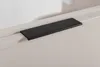 A close-up of a black handle on a light gray cabinet. Produktbild-Vorschau