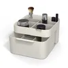 A makeup organizer with multiple compartments and a drawer, displayed on a white background. Náhled obrázku produktu