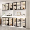 A modern white display cabinet with glass doors and integrated LED lighting, showcasing various decorative items and bottles. Podgląd zdjęcia produktu