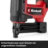 Close-up of the front of a red and black Einhell cordless nailer, showing the safety nose and part of the magazine. Produktbild-Vorschau