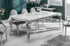 A dining room setting with a marble-top dining table and chairs. Náhled obrázku produktu