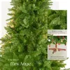 A close-up view of a green artificial Christmas tree with decorative lights and ornaments, accompanied by text overlays highlighting features. Produktbild-Vorschau