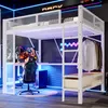 A loft bed with a desk and closet area, set up in a modern, gaming-themed room with neon lighting. Voir les images du produit