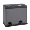 A gray and black dual-compartment trash can with foot pedals. Voir les images du produit
