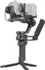 A camera gimbal stabilizer with a camera mounted on it, shown against a white background. Náhled obrázku produktu
