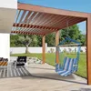 A hammock chair hangs from a wooden pergola on a patio, with a lawn and trees in the background. Anteprima dell’immagine prodotto