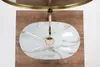 A top-down view of a marble-patterned vessel sink with a gold faucet, placed on a wooden surface. Anteprima dell’immagine prodotto