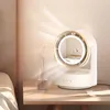 A desk fan with a built-in light and cosmetic mirror is placed on a bedside table next to a bed. Produktbild-Vorschau