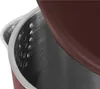 A close-up view of the inside of a kettle, showing the metallic interior with small holes and a brown exterior. Produktbild-Vorschau