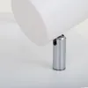 A close-up view of a white cylinder attached to a silver metal fixture, resting on a white surface. Produktbild-Vorschau